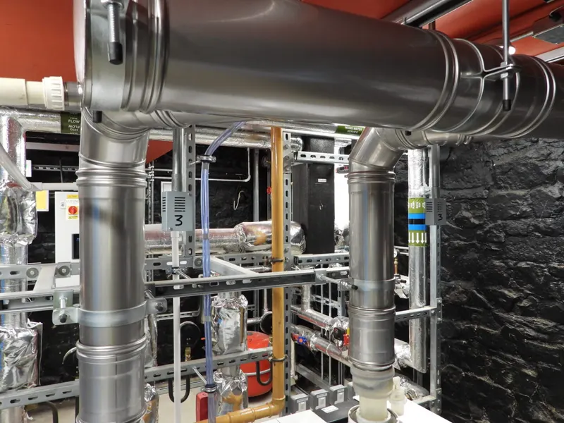 Completed plant room installation with insulated pipework and controls